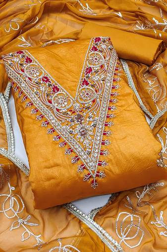Women's orange unstitched heavy handwork golden curse dress material 