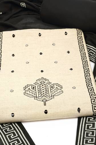 Unstitched suit set featuring block prints, complemented by a mul dupatta and bottoms.