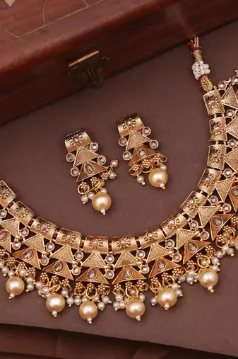 Antique gold plated pearl choker necklace set embellished with stones