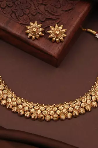 Artisan crafted antique gold necklace set with floral tops