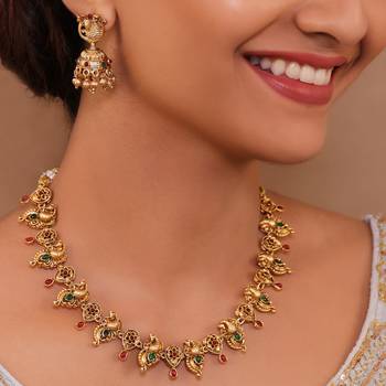 Peacock themed delicate gold-plated necklace set with jhumka earrings 1