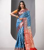 Sky blue satin silk blend emboss banarasi saree with zari woven ethnic motifs