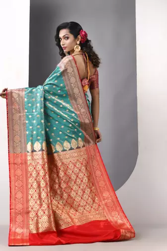 Teal satin silk blend emboss banarasi saree with zari woven ethnic motifs