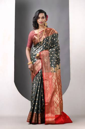 Bottle green satin silk blend emboss banarasi saree with zari woven ethnic motifs