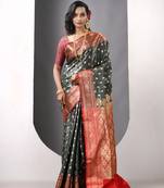 Bottle green satin silk blend emboss banarasi saree with zari woven ethnic motifs