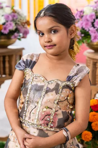 Grace in bloom: stunning floral gown with elegant embellishments for festive occasions