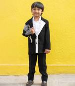 Stylish black blazer with silver embroidery and white lapel, paired with black trousers