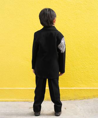 Stylish black blazer with silver embroidery and white lapel, paired with black trousers 3