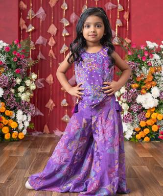 Add a pop of color to your celebrations with this vibrant purple printed top and flared palazzo set 1