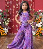 Add a pop of color to your celebrations with this vibrant purple printed top and flared palazzo set