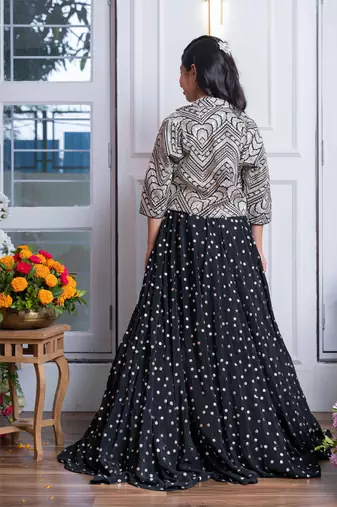 Elegant black embroidered crop top, jacket, and mirror work lehenga set