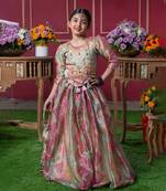 Shimmering pastel embroidered top and lehenga set with matching potli bag