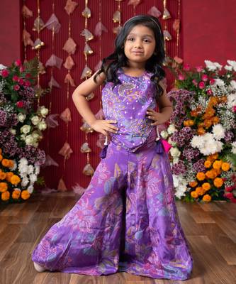 Add a pop of color to your celebrations with this vibrant purple printed top and flared palazzo set 5