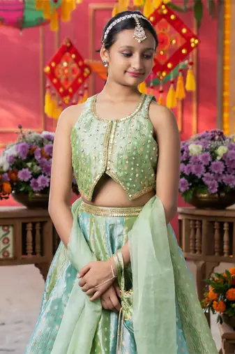 Enchanting pastel green lehenga set with golden embroidery