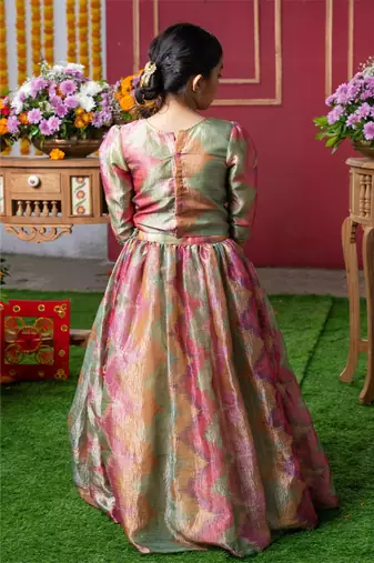 Shimmering pastel embroidered top and lehenga set with matching potli bag