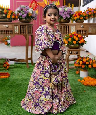Elegant embroidered lehenga with attached floral cape and matching potli bag 1