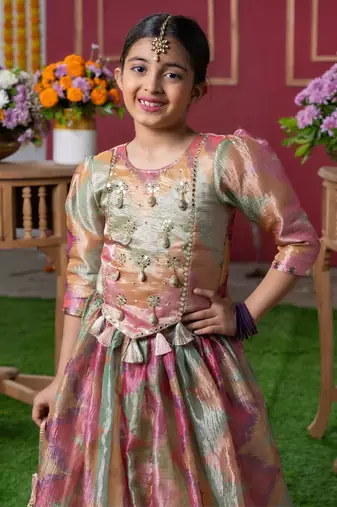 Shimmering pastel embroidered top and lehenga set with matching potli bag