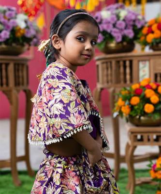 Elegant embroidered lehenga with attached floral cape and matching potli bag 2