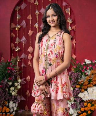 Floral elegance: a chic peplum set with matching potli for festive charm 2