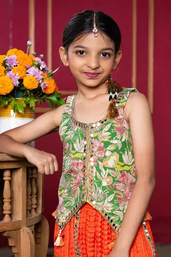 Embroidered jacket-style blouse with mirror work and vibrant sharara pants
