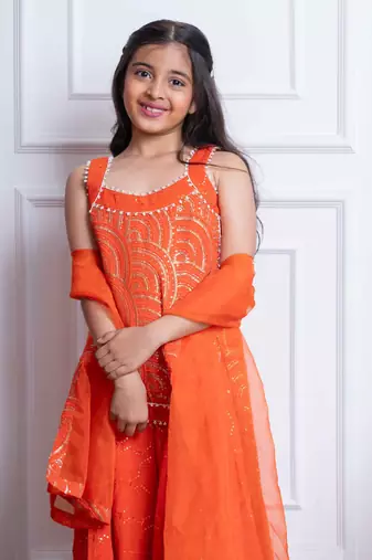 Vibrant orange mirror work sharara set with embroidered crop top and dupatta