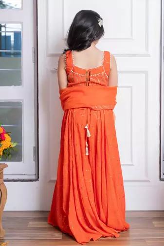 Vibrant orange mirror work sharara set with embroidered crop top and dupatta