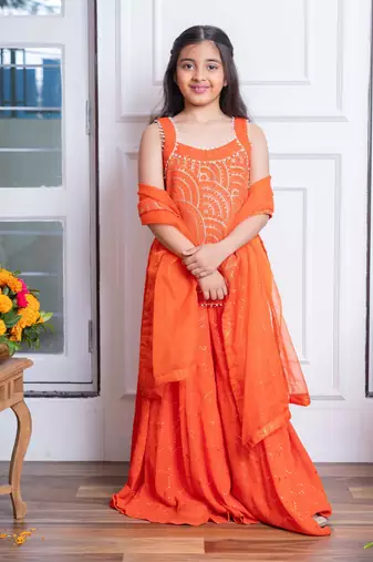 Vibrant orange mirror work sharara set with embroidered crop top and dupatta