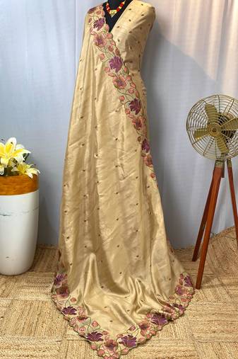 Cream tussar silk saree with all over contrast embroidery work and motifs with cutwork border
