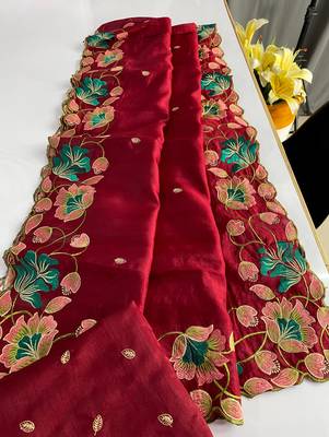 Red tussar silk saree with all over contrast embroidery work and motifs with cutwork border 1