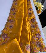 Yellow tussar silk saree with all over contrast embroidery work and motifs with cutwork border