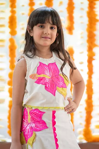 Exquisite floral embroidered top and lehenga with potli bag