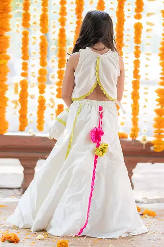 Exquisite floral embroidered top and lehenga with potli bag