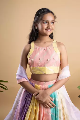 Elegant multicolored brocade lehenga set with intricate gold motifs and a matching pastel dupatta