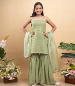 Elegant light green sleeveless kurti with sequin details, paired with matching sharara pants and a sheer dupatta