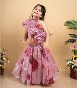 Charming off-shoulder pink ruffle top paired with a flowy floral lehenga for a delightful festive look