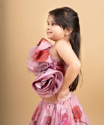 Charming off-shoulder pink ruffle top paired with a flowy floral lehenga for a delightful festive look 2