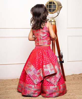 Vibrant red lehenga set with a multicolored patchwork blouse and golden motif print, perfect for festive occasions 3