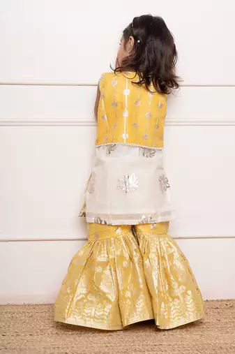 Charming ivory and yellow sharara set with delicate silver floral embroidery and playful appliqu  s