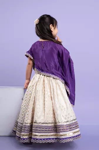Elegant purple cape-style top with a white lehenga  set