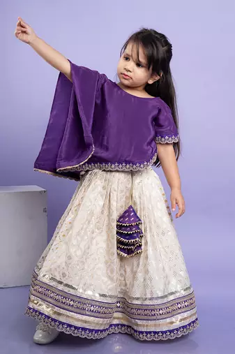 Elegant purple cape-style top with a white lehenga  set