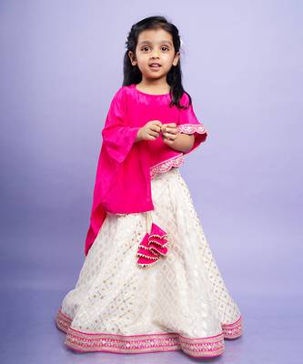 Elegant pink cape top with a white and gold lehenga, perfect for festive celebrations 1