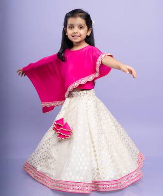 Elegant pink cape top with a white and gold lehenga, perfect for festive celebrations 3