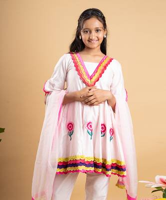 Charming white kurta set with colorful scalloped details and floral embroidery, perfect for festive occasions 2