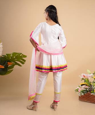 Charming white kurta set with colorful scalloped details and floral embroidery, perfect for festive occasions 3