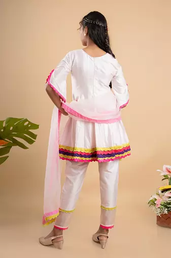 Charming white kurta set with colorful scalloped details and floral embroidery, perfect for festive occasions
