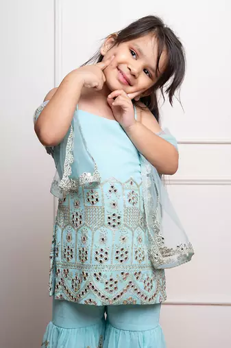 Elegant aqua blue sharara set with intricate mirror work and embroidery, perfect for festive occasions and celebrations