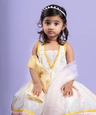 Charming white dhoti-style set with floral embroidery and playful yellow and pink accents, perfect for festive occasions 2
