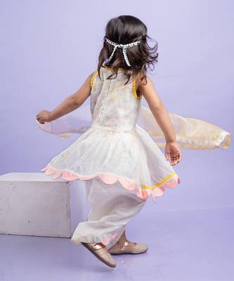 Charming white dhoti-style set with floral embroidery and playful yellow and pink accents, perfect for festive occasions 4
