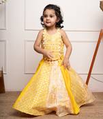 Vibrant yellow sleeveless dress with playful prints and tassel accents.