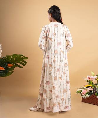 Vibrant ivory ensemble with colorful prints and tassel accents 4